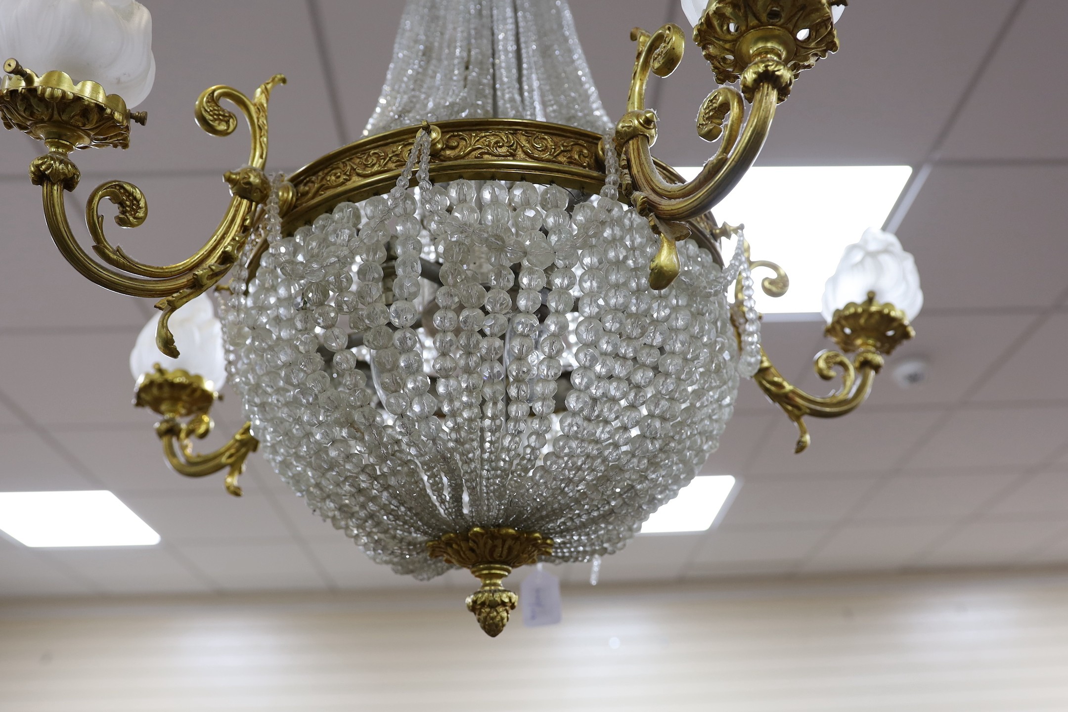 A cut and beaded glass and ormolu bag chandelier, approx 96cms high, approx 75cm diameter